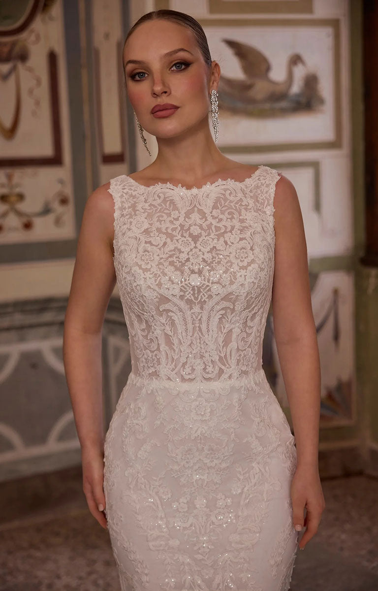 A close-up frontal photo of woman modelling Veni Infantino Algarve 63332 - Fitted Lace Wedding Dress with High Illusion Neckline, Sparkle and Detachable Belt