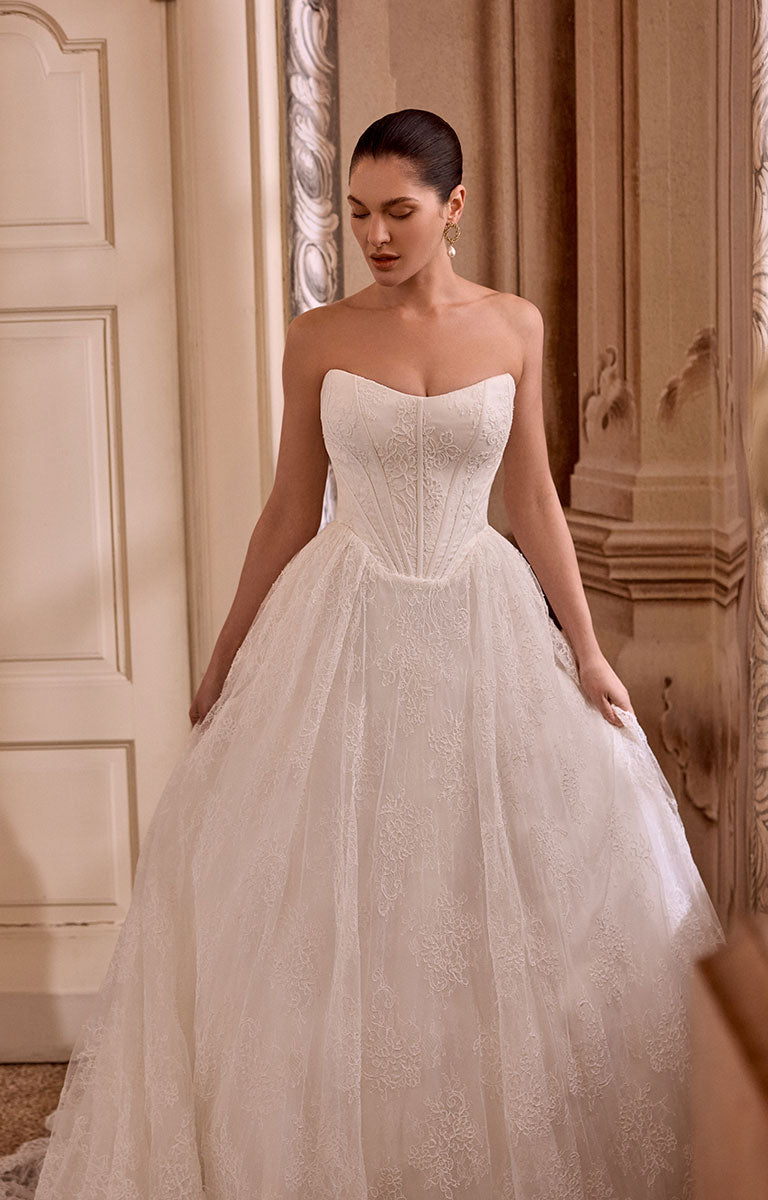 Woman wearing Leighton 88468 by Justin Alexander - Corded Lace A-Line Wedding Dress with Basque Waist in an elegant indoor setting.