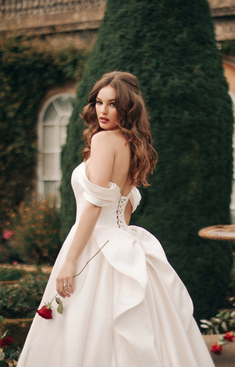 Woman wearing D362 Belle - Disney Fairytale Weddings Ivory Wedding Dress