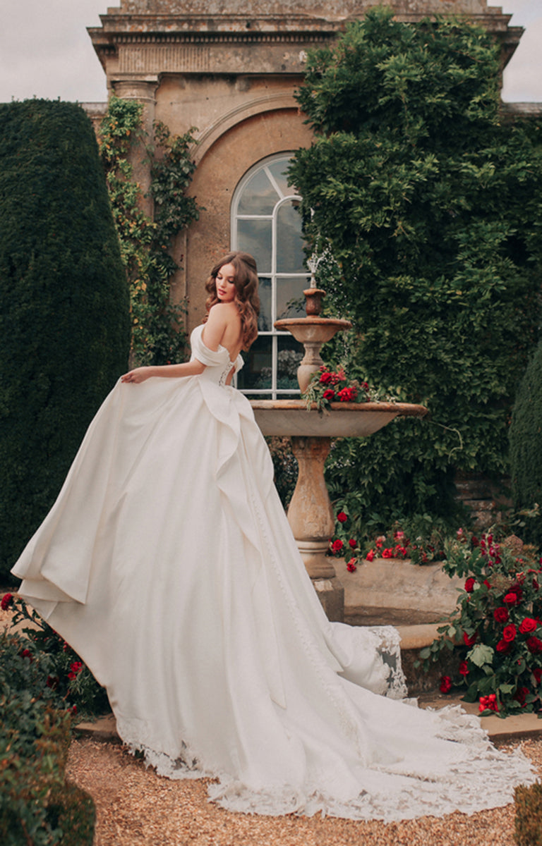 Woman wearing D362 Belle - Disney Fairytale Weddings Ivory Wedding Dress