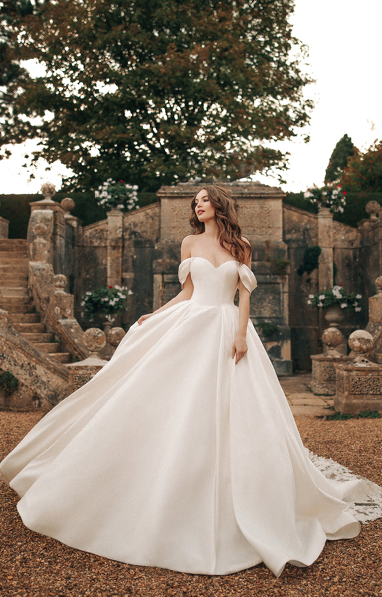 Woman wearing D362 Belle - Disney Fairytale Weddings Ivory Wedding Dress