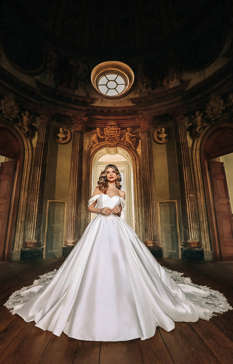 Woman wearing D362 Belle - Disney Fairytale Weddings Ivory Wedding Dress