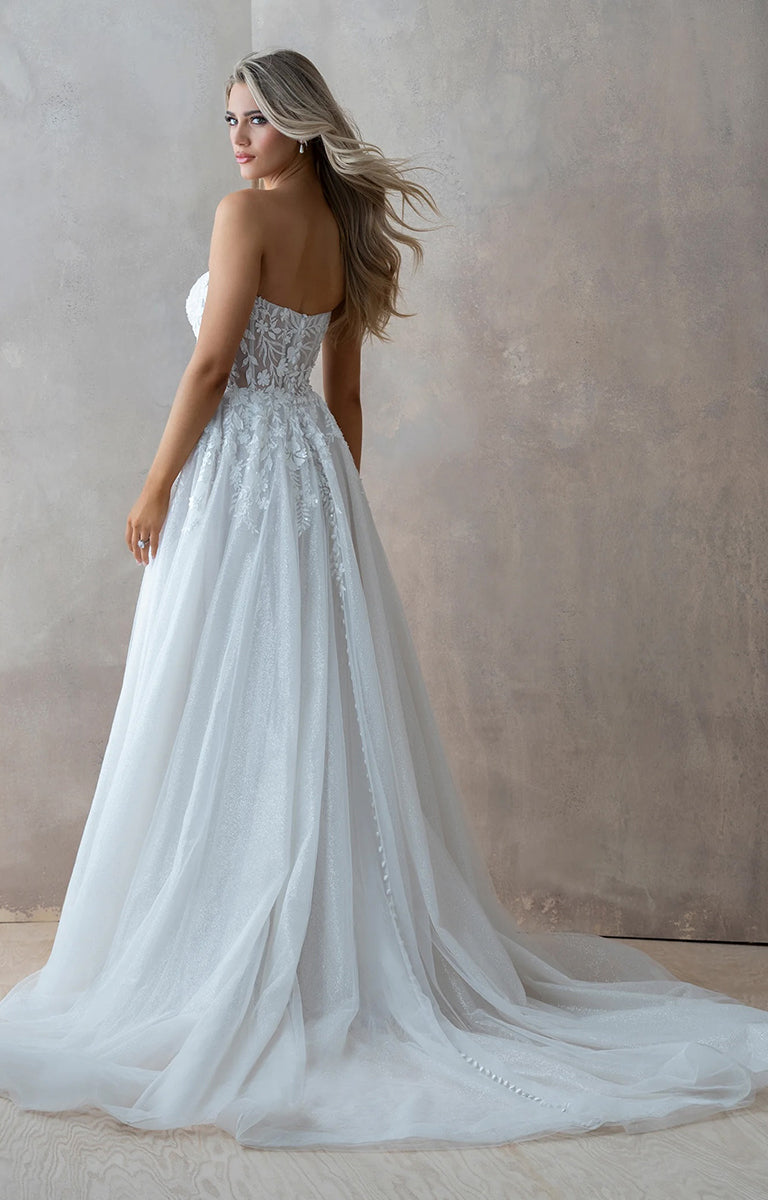 Woman wearing Benedita E461 by Abella Bridal - Beaded Lace A-Line Tulle Wedding Dress with intricate detailing against a neutral background