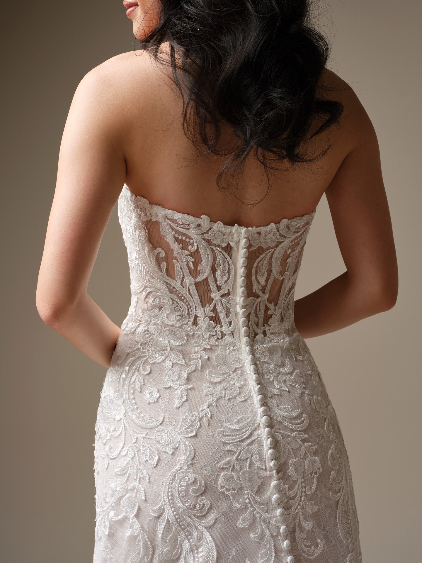 Farrah by Maggie Sottero - Sequin Lace A-Line Wedding Dress with Plunging Neckline with intricate detailing on a neutral background