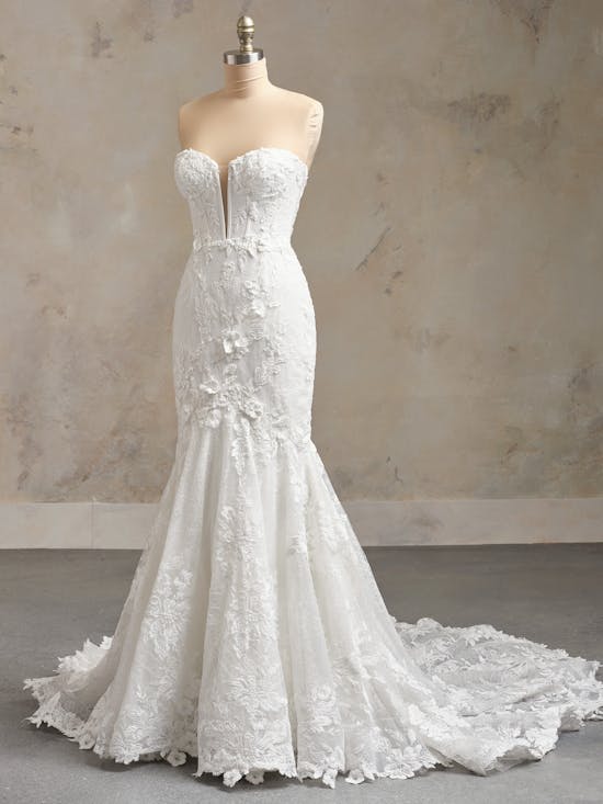 Ortensia by Maggie Sottero - White lace wedding dress on a mannequin against a neutral background