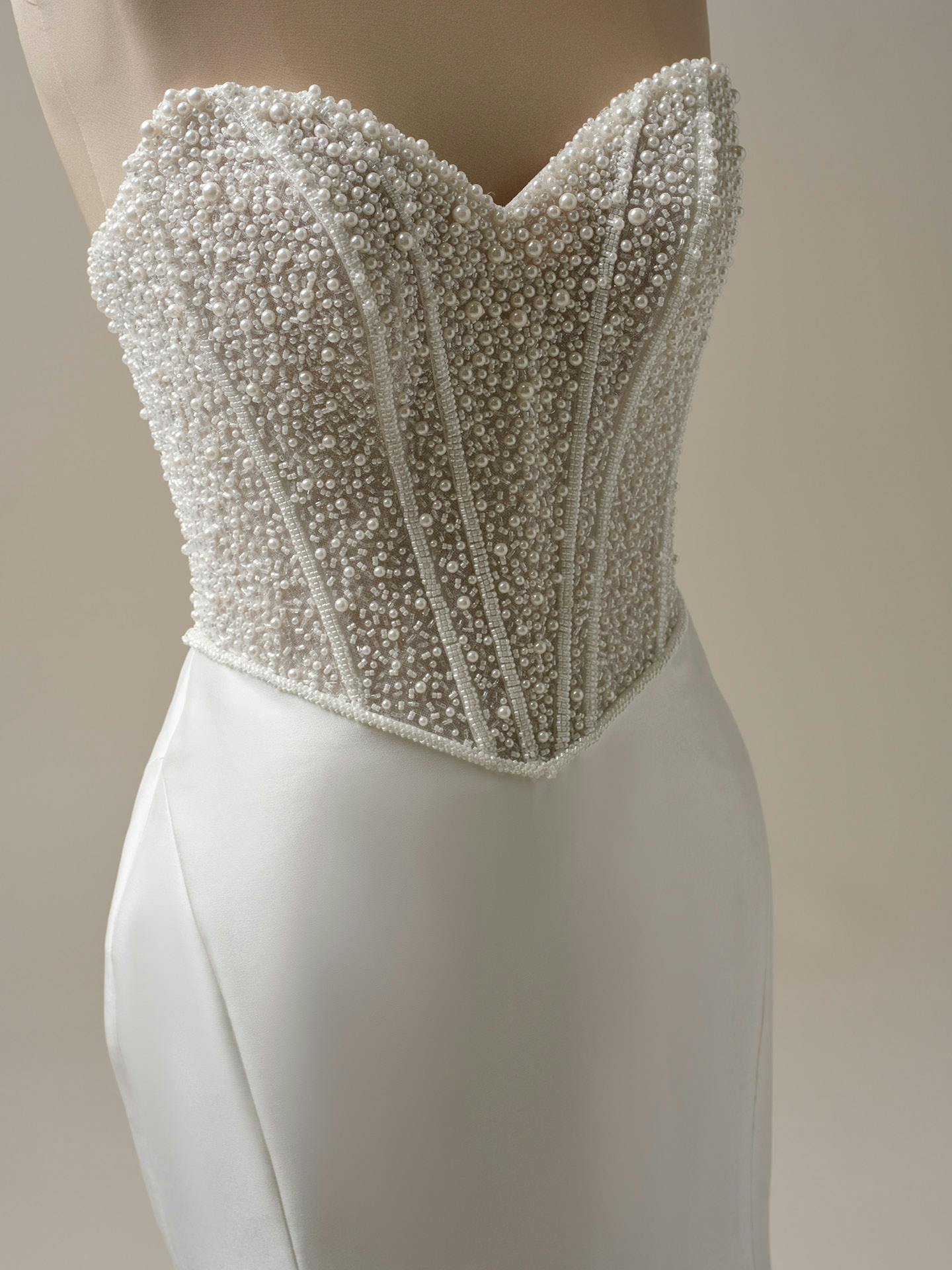 Beaded wedding dress with a plain background