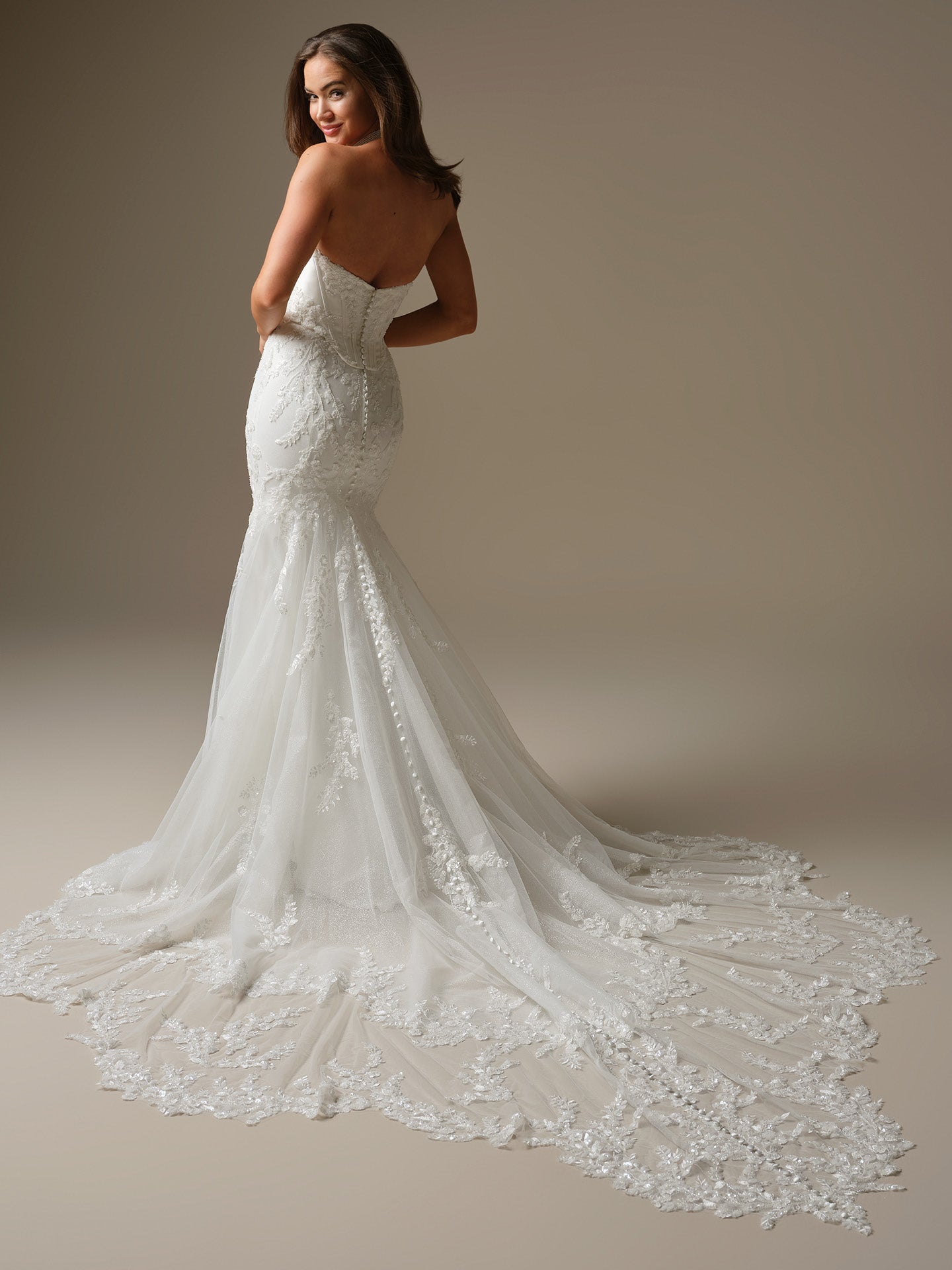 Woman wearing Wyntelle by Maggie Sottero - Fit-and-Flare Wedding Dress with Cat Eye Neckline in All Ivory against a neutral background