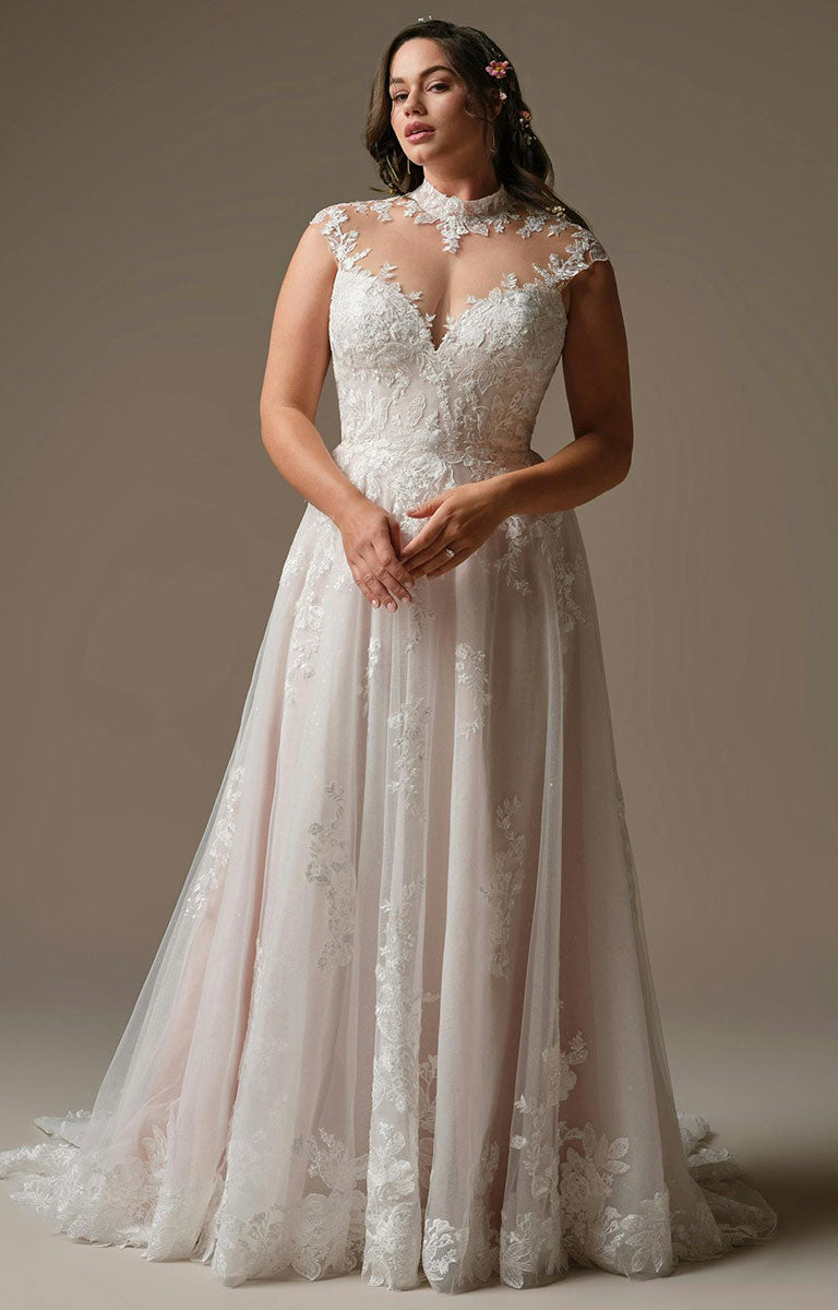 Woman wearing Cody by Rebecca Ingram - Illusion Neck Sequin Lace A-Line Wedding Dress against a neutral background
