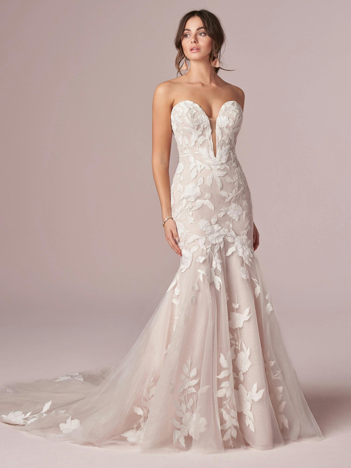 Hattie by Rebecca Ingram - White strapless wedding dress with floral details on a pink background