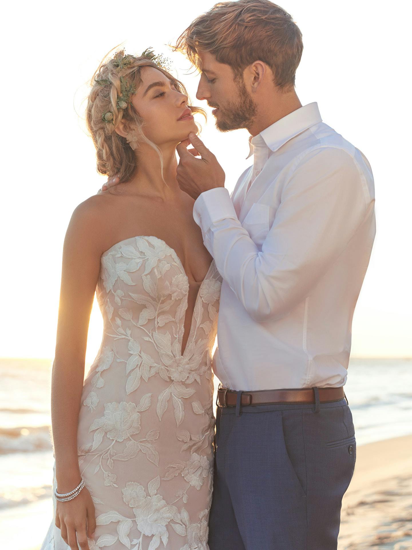 Couple embracing on a beach with a blurred background