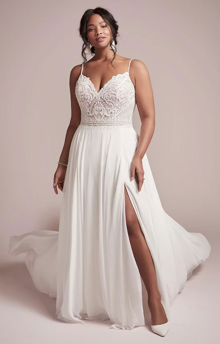 Woman wearing Lorraine by Rebecca Ingram - Beaded Chiffon Sheath Wedding Dress with V-Neckline and Split with lace top and sheer sides on a plain background