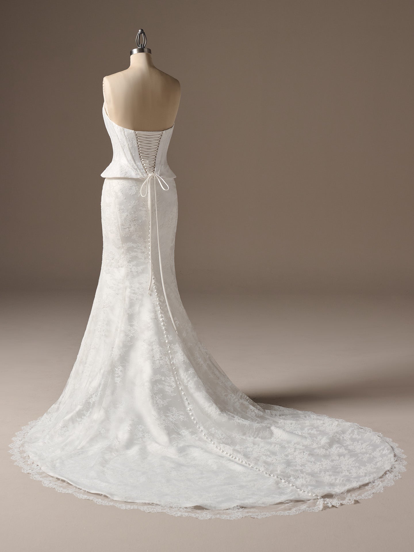 Lassen by Sottero and Midgley - Strapless Chantilly Lace Sheath Wedding Dress with Cat-Eye Neckline and Corset Bodice on a mannequin against a neutral background