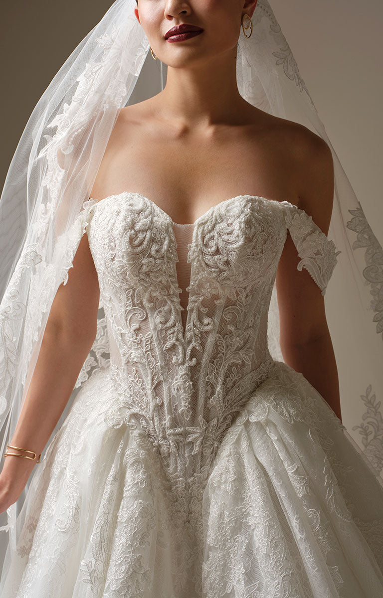 White lace wedding dress with a veil