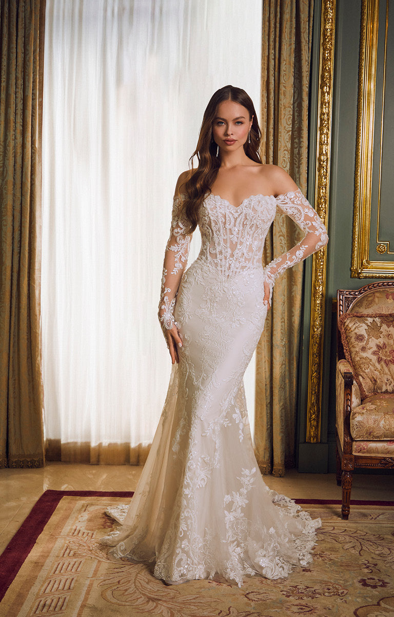 Woman wearing a white lace wedding dress in an elegant room with curtains and a chair.